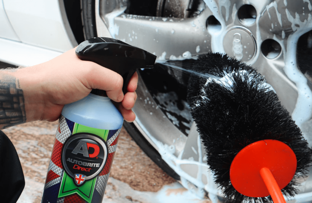 Applying Wheel and Tyre cleaner to a large spoke brush